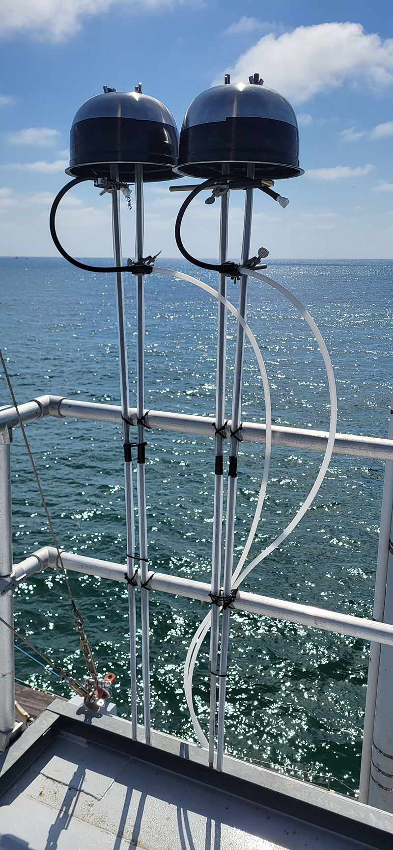 Overlooking the Pacific Ocean, two salad bowl ice-nucleating particle samplers are installed on the Ellen Browning Scripps Memorial Pier in La Jolla, California.